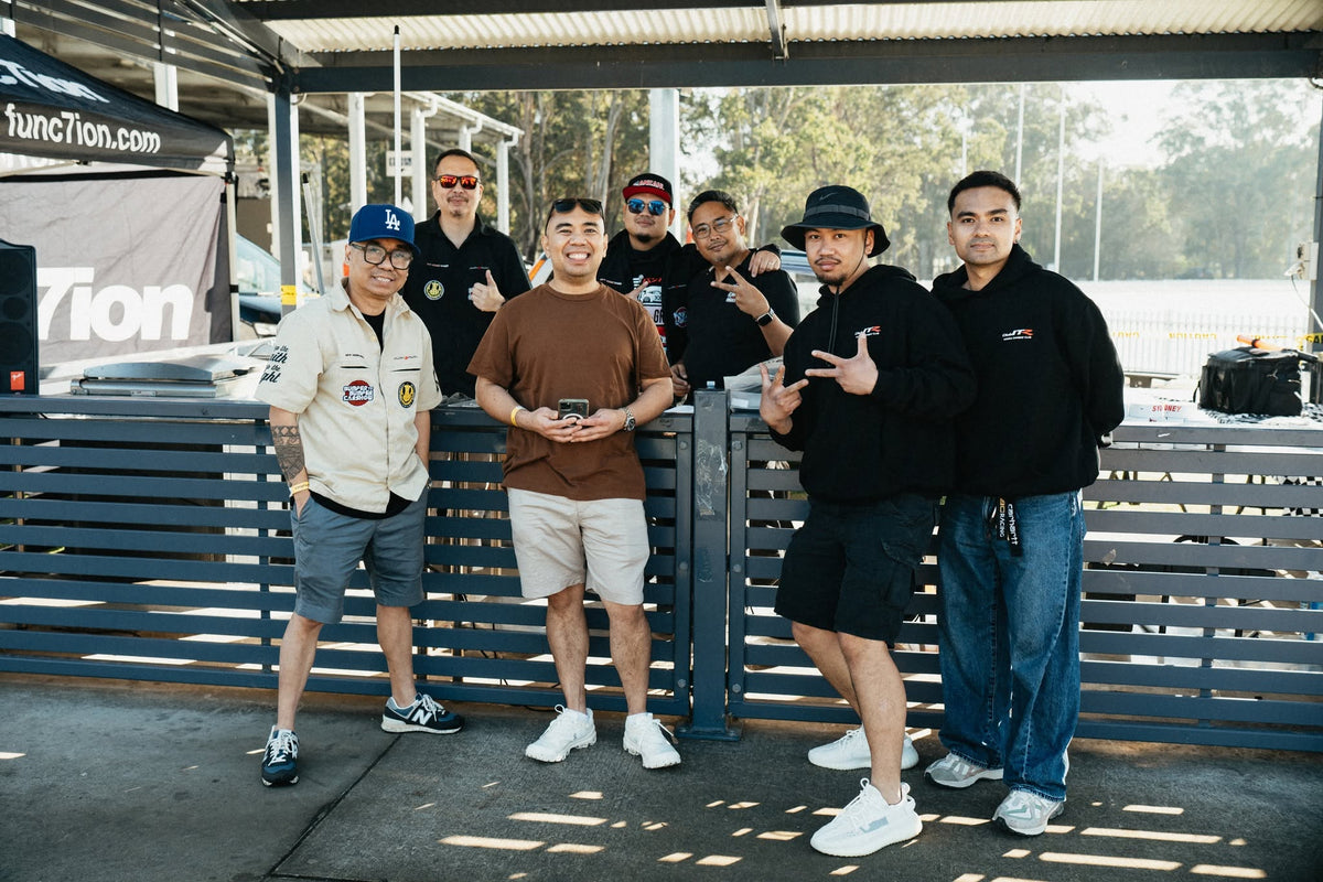 Group posing beside the FUNC7ION stand at Bumper2Bumper Sydney 2026